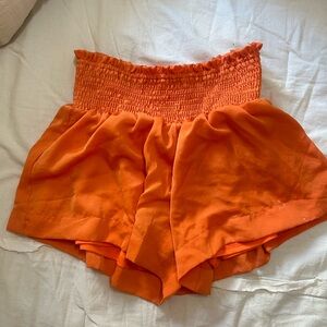 Super cute TCEC orange flowy dress shorts. Size small, but could fit M or L.